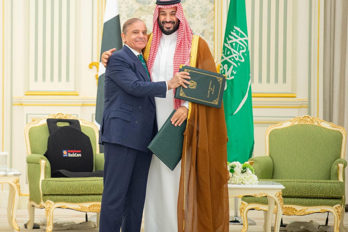 Saudi Crown Prince Mohammed bin Salman and Pakistan Prime Minister Shehbaz Sharif embrace each other on the day they sign a defence agreement, in Riyadh, Saudi Arabia, September 17, 2025. Saudi Press Agency/Handout via REUTERS