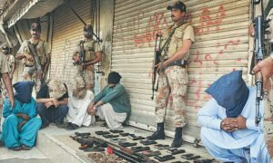 Sindh Rangers detaining individuals with illegal firearms